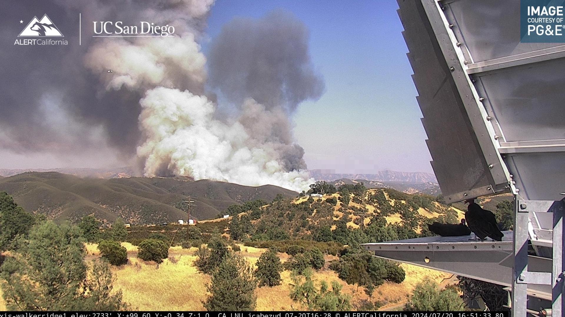 Cal Fire says roughly 50 structures are threatened by the rapidly spreading grass fire — 30 in Lake County and 20 in Colusa County.