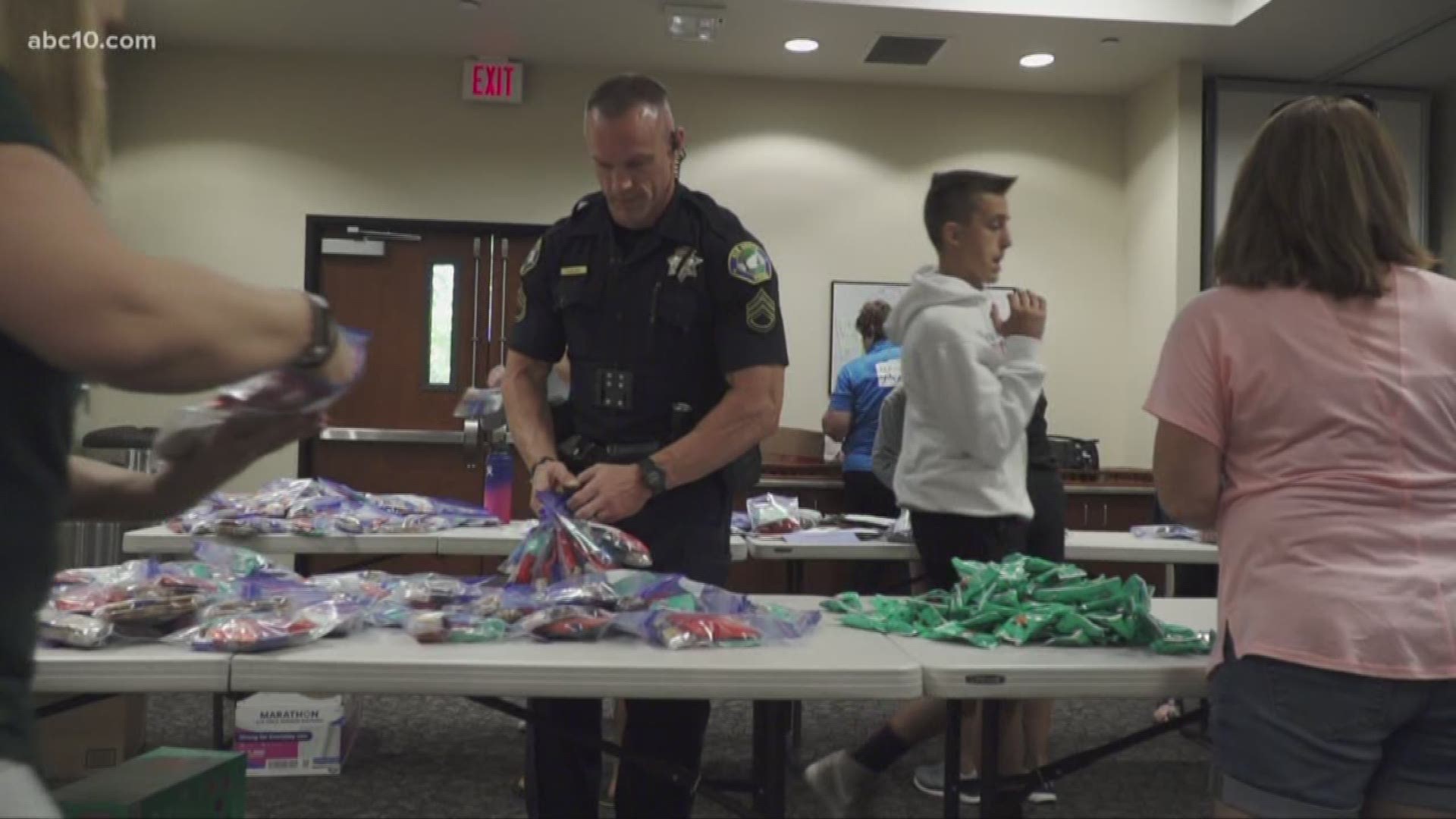 Ahead of Deputy Mark Stasyuk's memorial service, volunteers with the End of Watch Fund packed the City Council Chambers in Elk Grove to organize snack bags and thousands of letters for officers who will attend on Saturday.