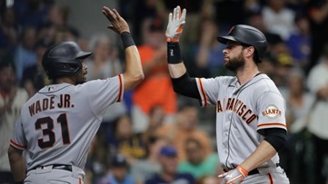 Belt homers twice as Giants outlast Brewers 9-6 in 11