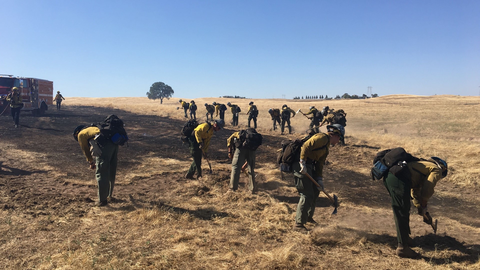 A small vegetation fire in Galt is already threatening several structures as multiple fire crews work to put it out, Cal Fire confirmed.