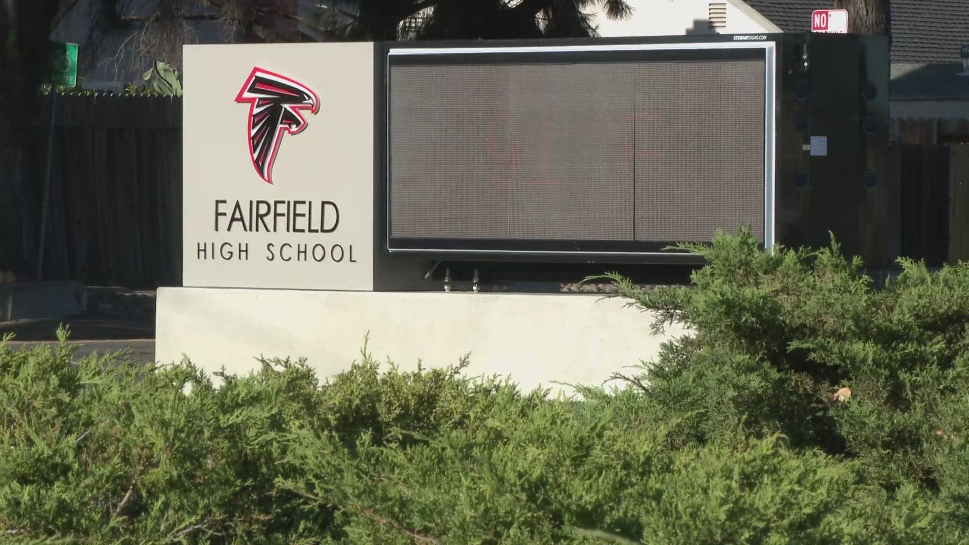 Backpacks were being searched to find a missing phone when the student asked to speak with a staff member in the hallway.