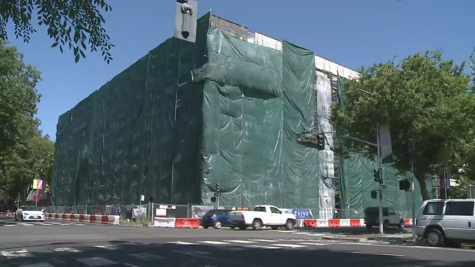 The apartments were stacked up like lego blocks. The complex is located on 16th and N Street. Hidden behind a wall of plastic tarps and scaffolding is a 118 apartments waiting for the water and power to be turned on.