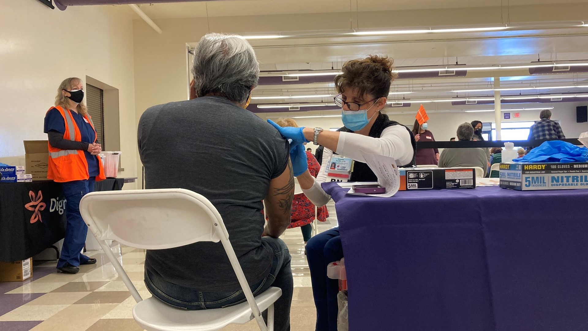 As people wait for guidelines of what people can and can't do after being fully vaccinated, many received their second dose at a clinic at Cristo Rey High School.