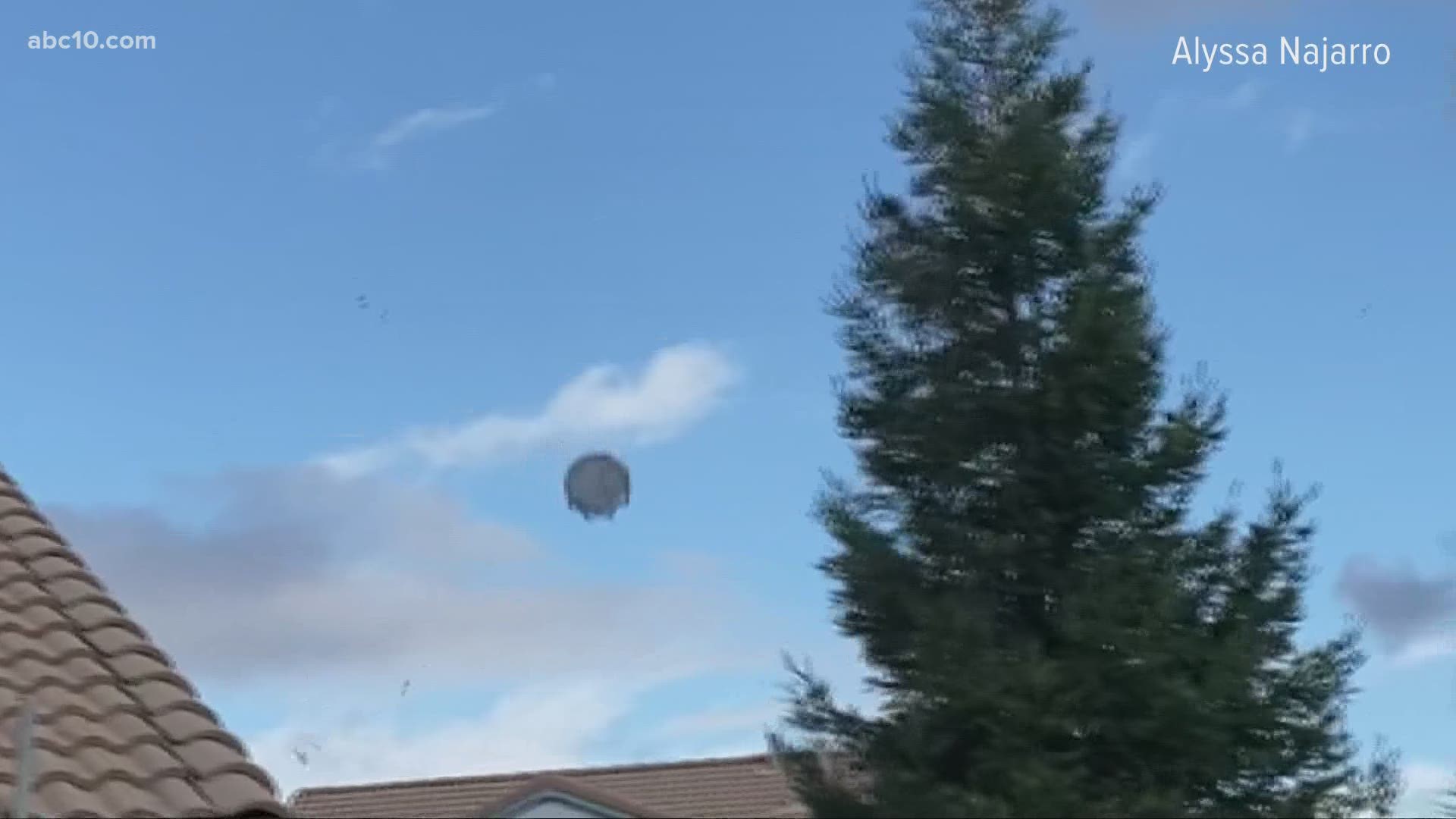 A family from Lincoln captured a trampoline being carried away by wind after they heard a large noise from the home that sounded like someone throwing stuff outside.
