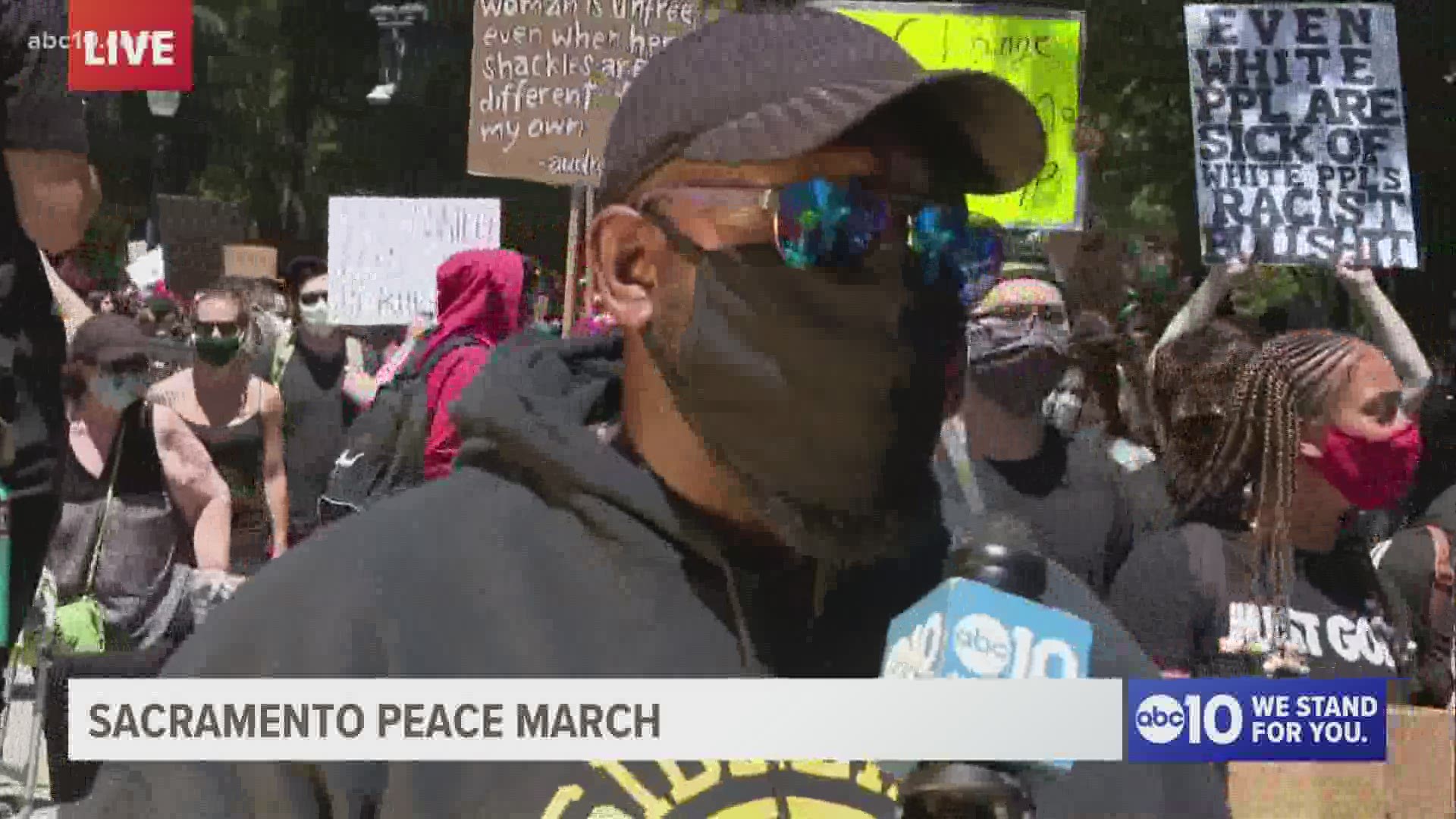 Actor Christopher Michael Holley talks with Mark S. Allen at the Sacramento Peace March about the need for change, saying, "this is just the beginning."