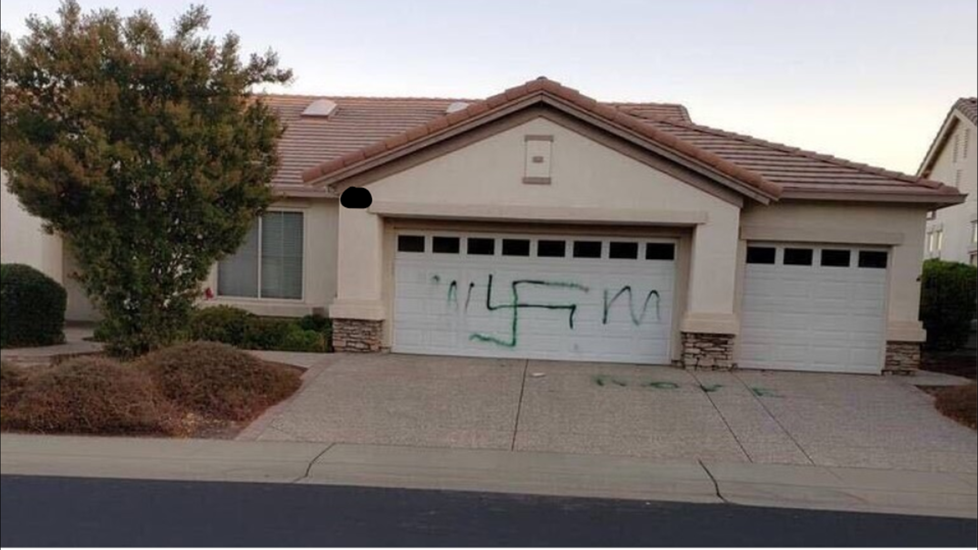 Police are investigating after two garage doors in a Lincoln neighborhood were spray painted. Neighbors believe the vandalism was politically motivated.