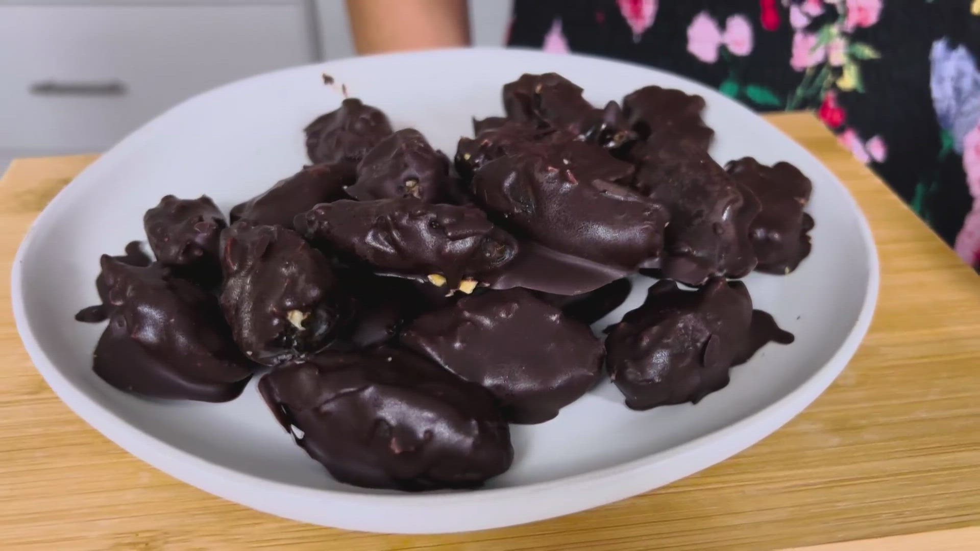 These chocolate-covered stuffed dates taste similar to a candy bar but they're made with healthy ingredients.