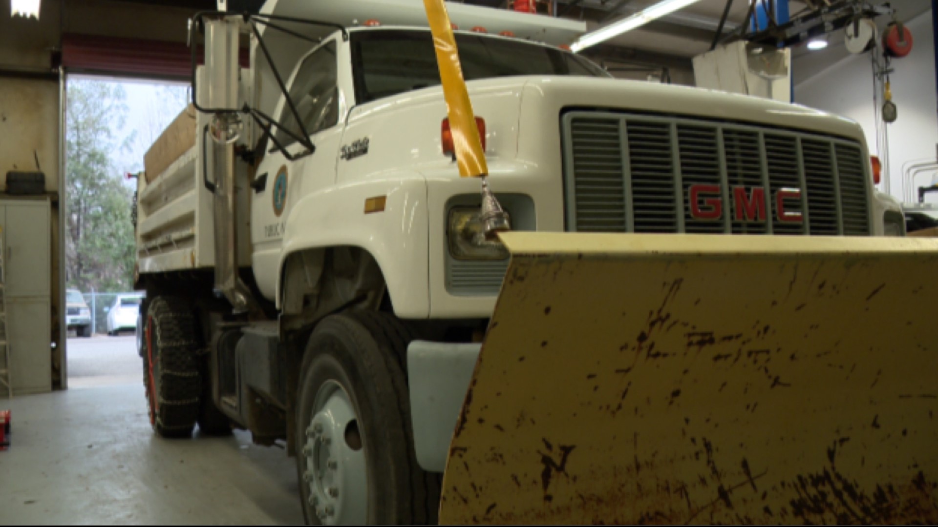 The Auburn Public Works department has outfitted dump trucks with snowplows, chains and a bed full of sand to help clear the roads