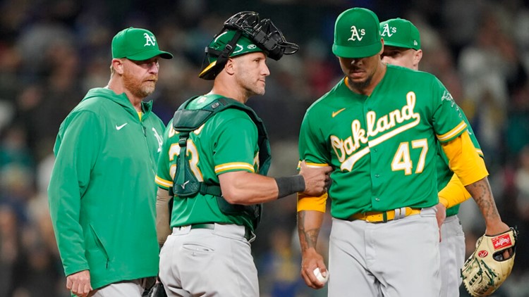 Contending Mariners win for 10th time in 11 games; A's out