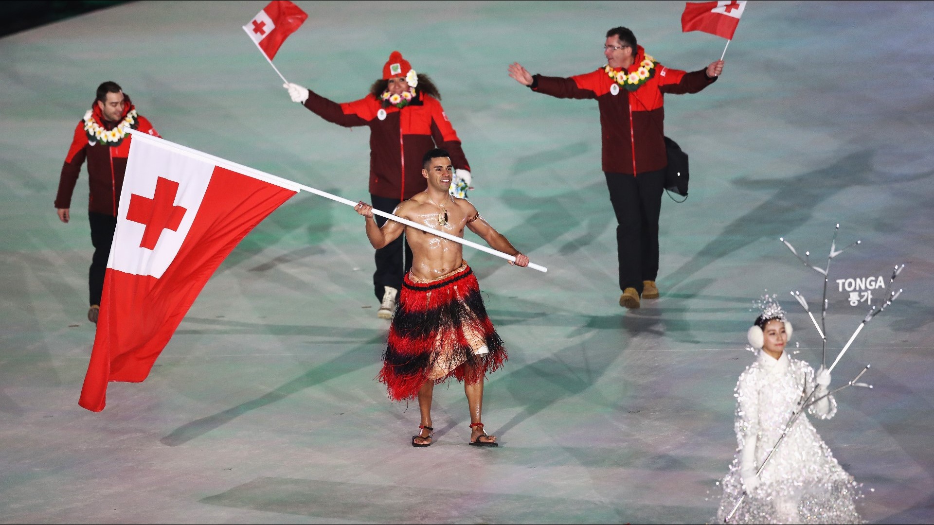 Tonga's flag bearer is shirtless again and it's freezing at the