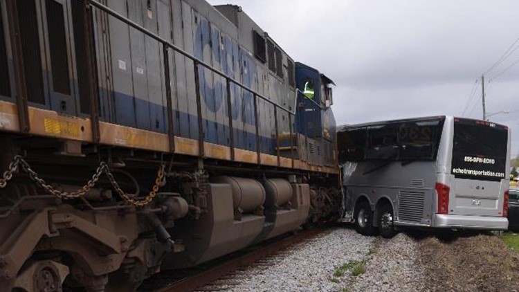 Fatal train collision with bus resulted from unsafe, humped road