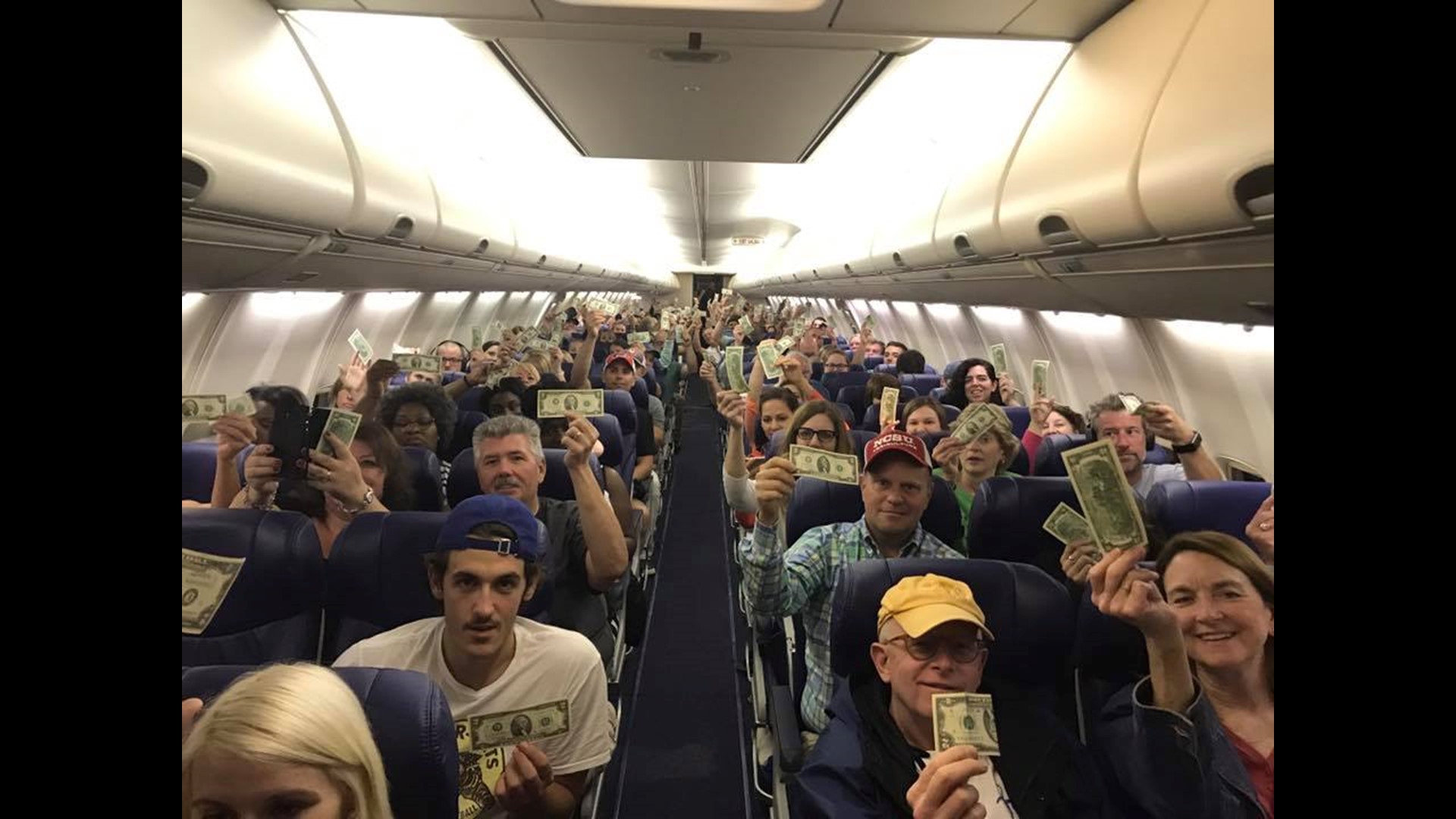 Bind Man Man honors dad by handing out $2 bills to every passenger on N.C. bound ...