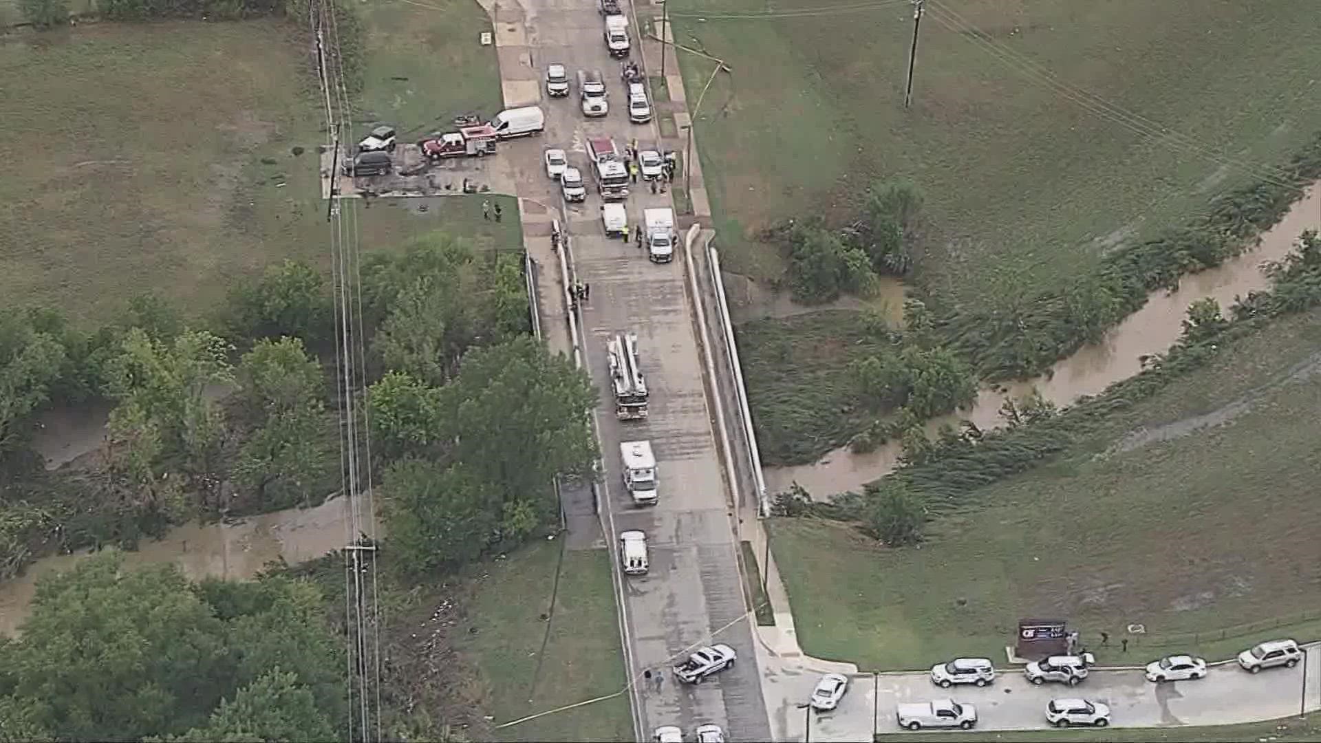 Officials in Mesquite say a body was pulled from a vehicle that was swept off a bridge during flash flooding.