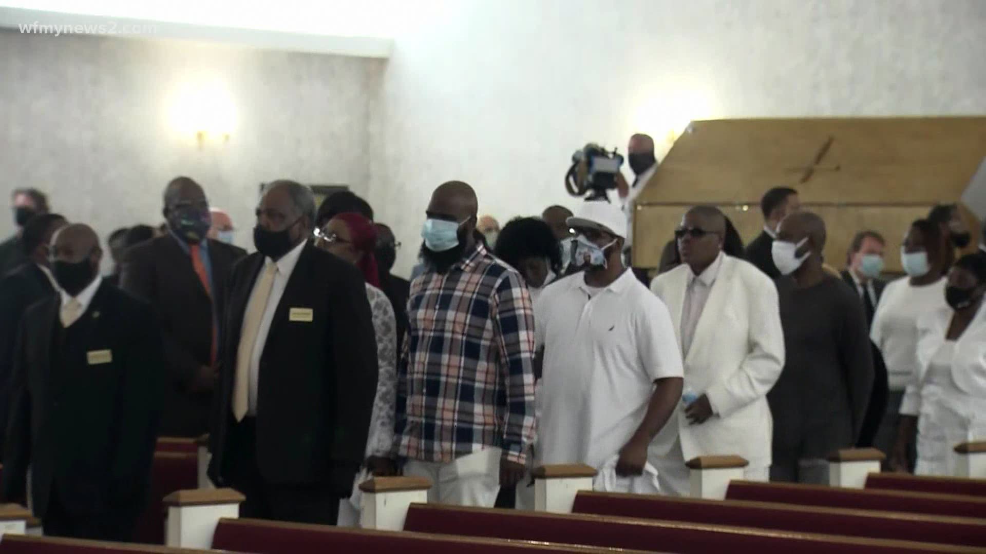Hundreds of mourners paid respects during a public viewing before the service.
