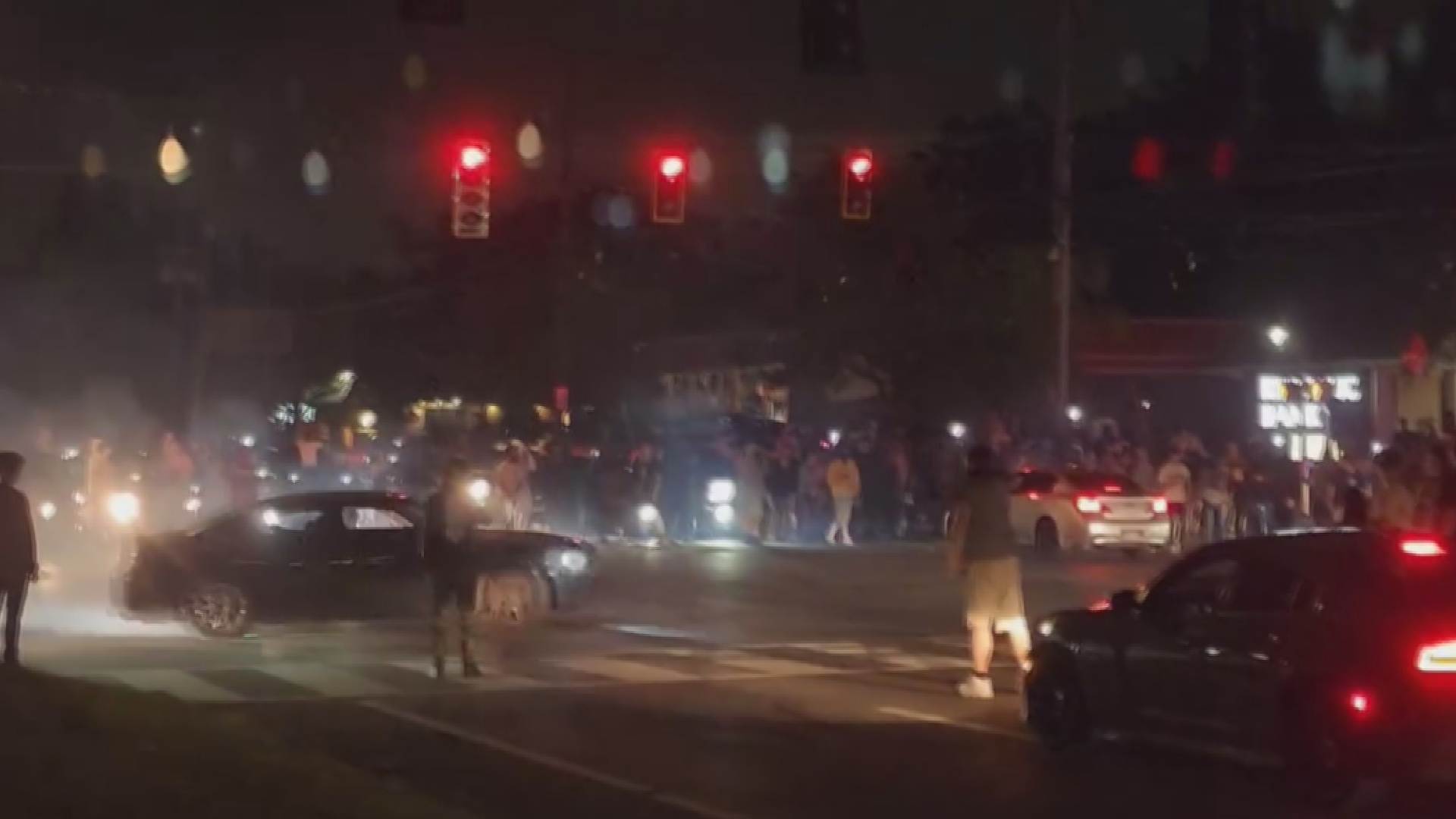 People jumped on LMPD cruisers as police tried to break up an illegal street racing takeover over Labor Day weekend.