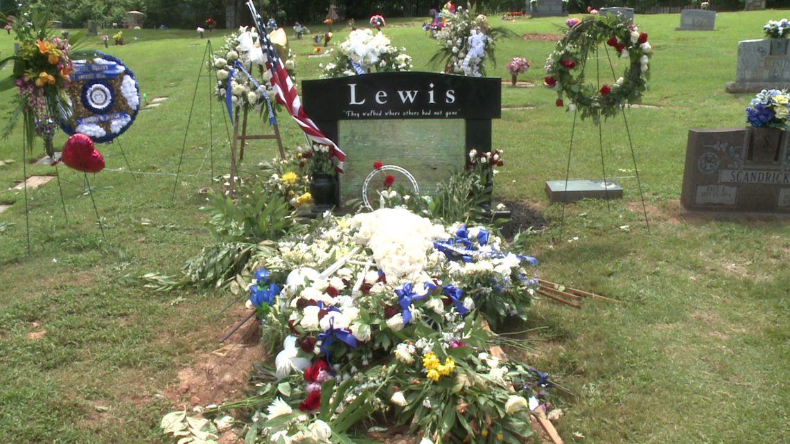 Flowers on John Lewis' grave at SouthView Cemetery in Atlanta