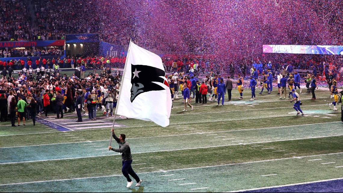 New England Patriots quarterbacks Tom Brady (L) and Brian Hoyer (R)  celebrate before defeating the Los Angeles Rams 13-3 in Super Bowl LIII at  Mercedes-Benz Stadium in Atlanta on February 3, 2019.