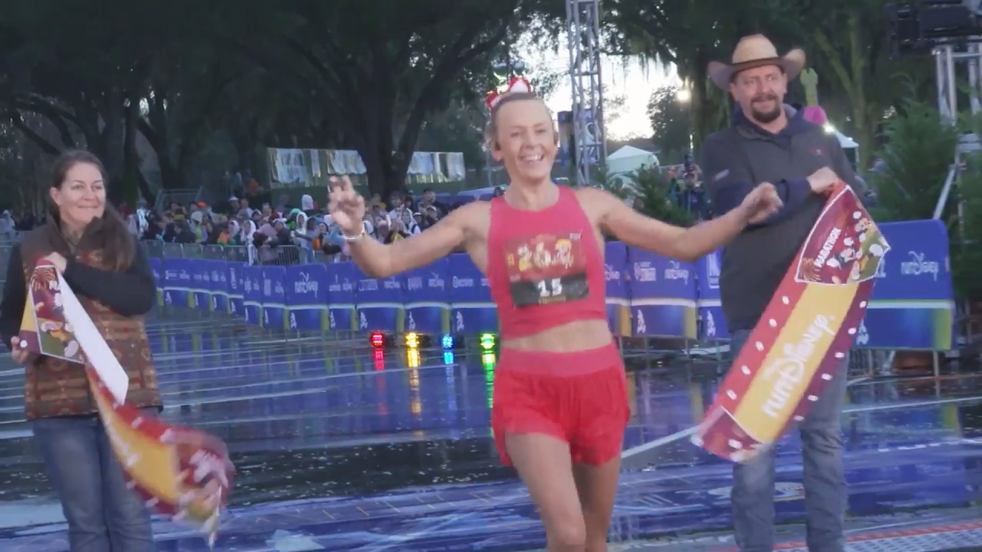 Grand Rapids woman Stephanie Muscat wins the women's division of the Walt Disney World Marathon.